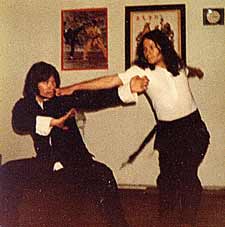Sifu Dave Lacey counter -attacking from the side with the Buck Sing CLF's long range charp chui (pantherfist) punch - 1975